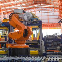 Robots welding in a production line